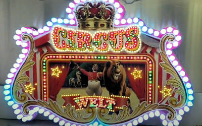 Circus Welt Schild mit LED-Lauflicht